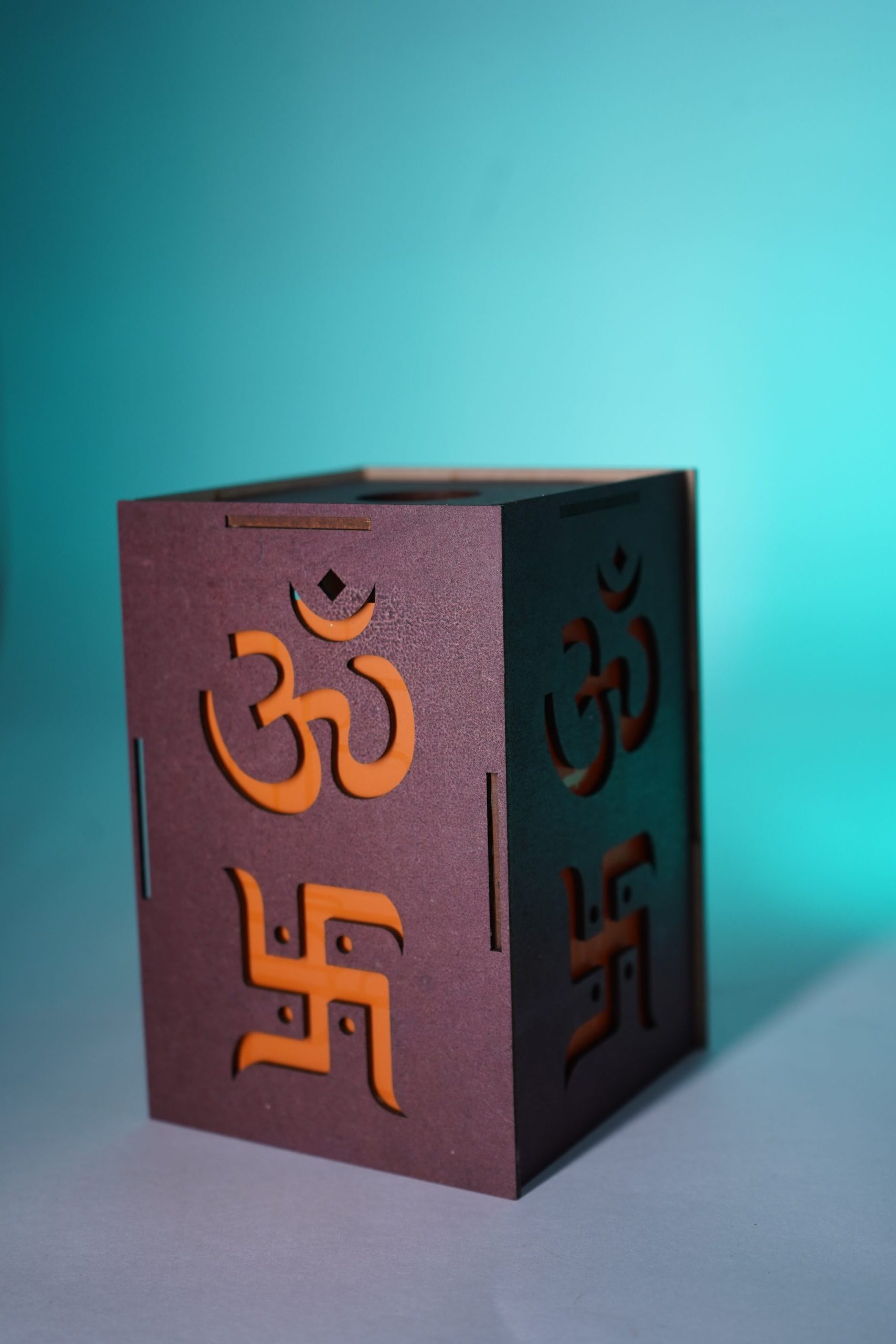 SML04983-scaled-e1757009654691.jpg Decorative LED Shadow Box with Om and Swastik Design, Brown and Orange - Image 1