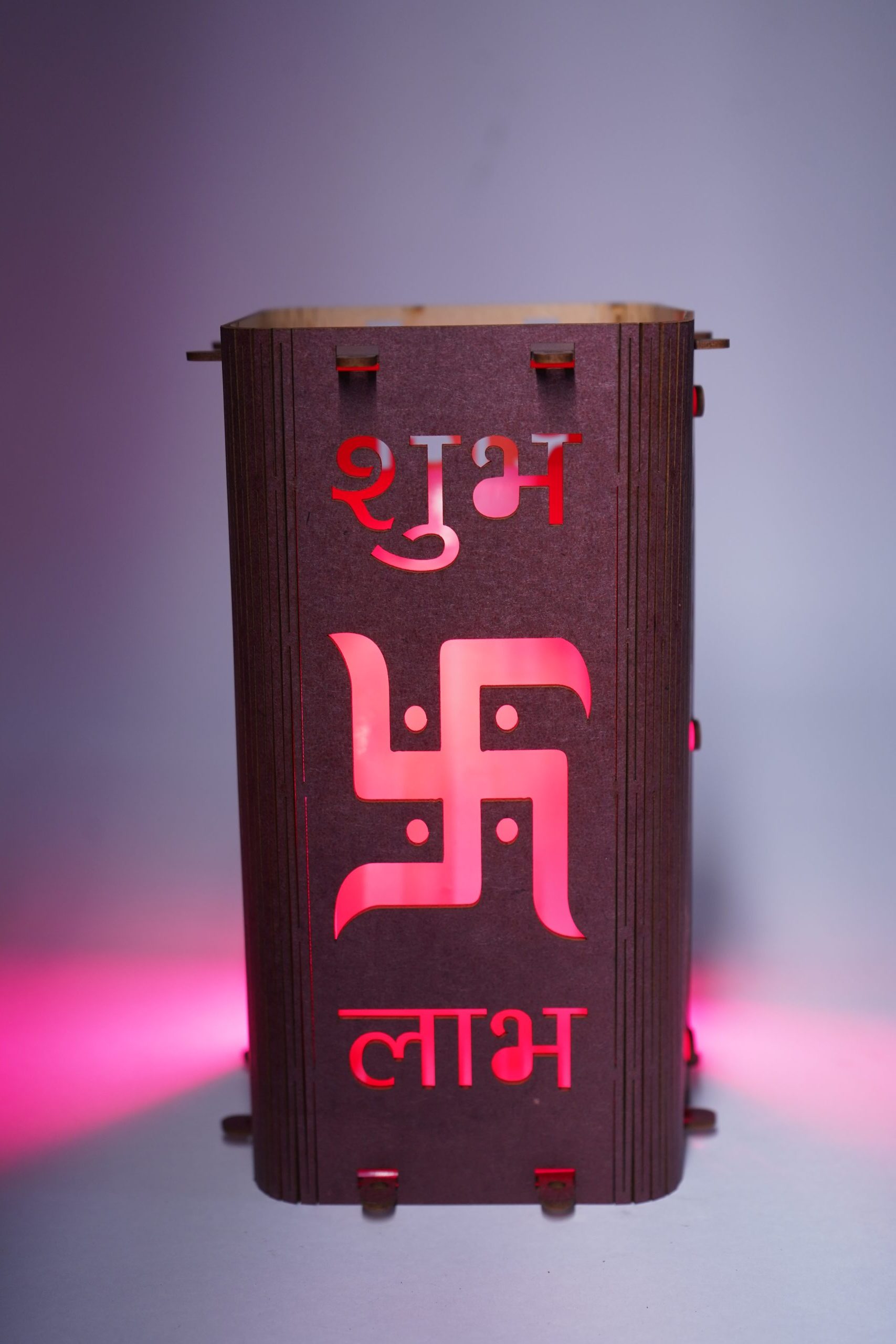 SML05011-scaled-e1757180874102.jpg Decorative Wooden Wall Lamp with Sanskrit Symbol, LED Backlit, Pink Light - Image 1